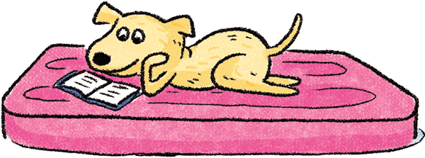 A dog is reading a book with its tail wagging.