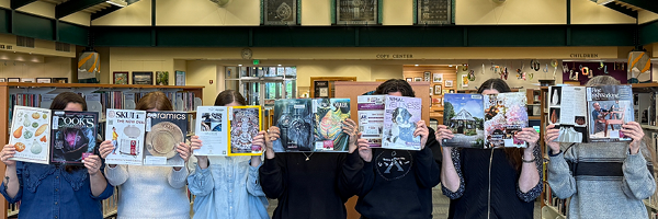 People reading magazines.